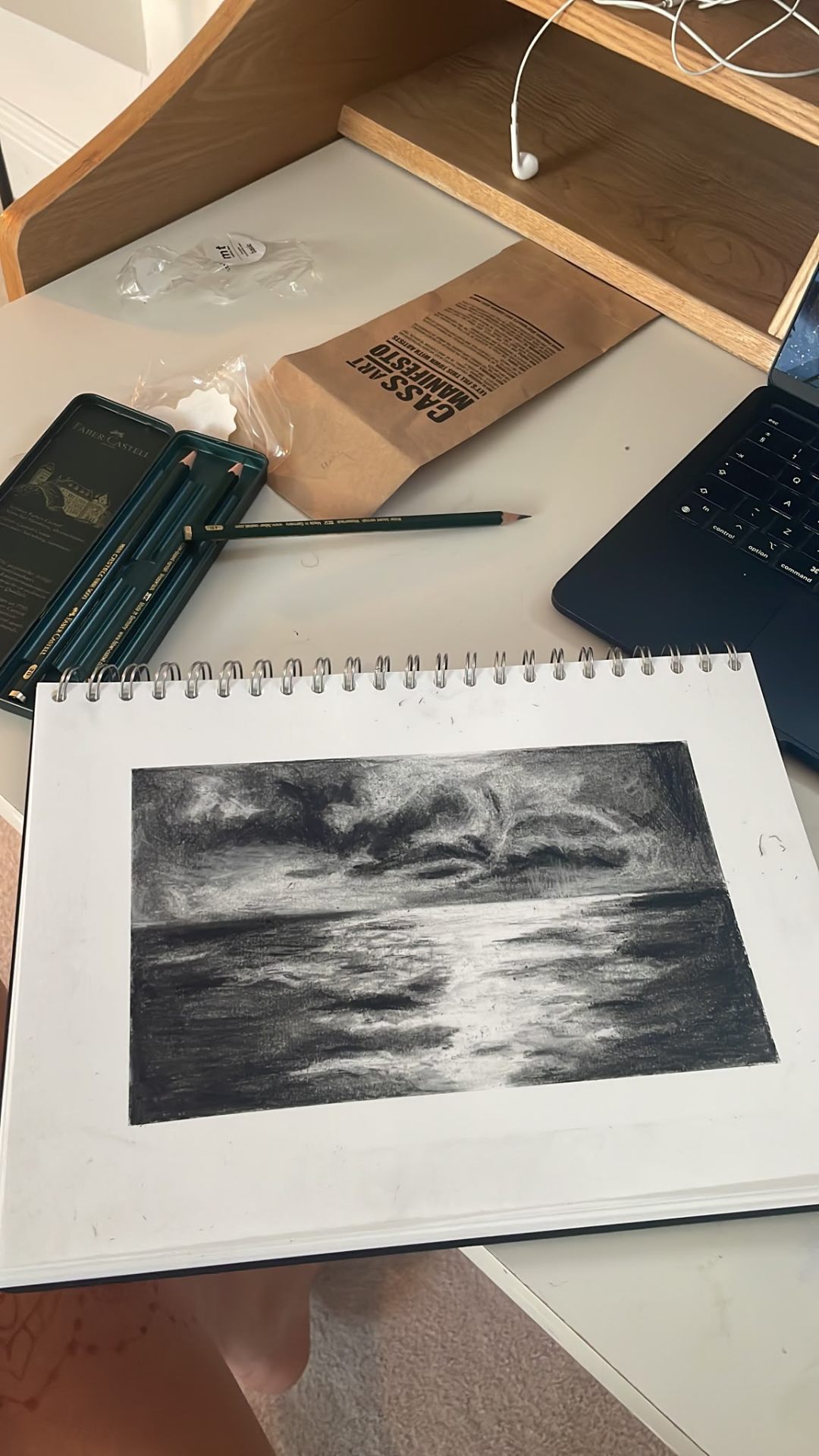 Charcoal drawing in a studio sketchbook